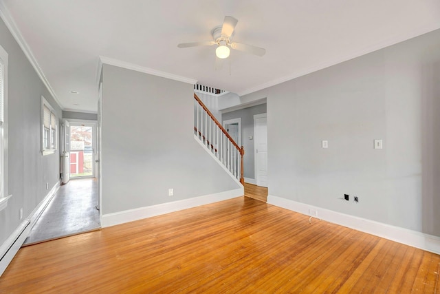 unfurnished room featuring a baseboard heating unit, stairway, light wood-type flooring, crown molding, and a ceiling fan