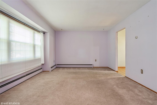 unfurnished room featuring carpet flooring, baseboards, and a baseboard radiator