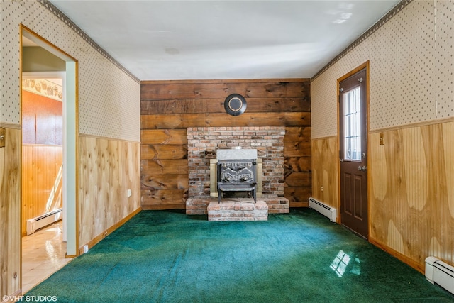 unfurnished living room with a baseboard radiator, a wainscoted wall, and wallpapered walls