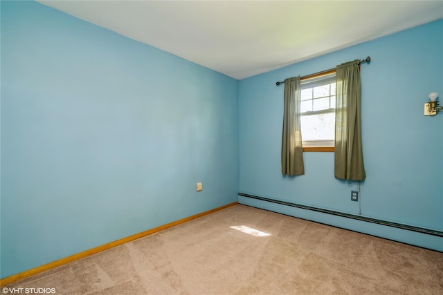 carpeted empty room featuring baseboards and baseboard heating