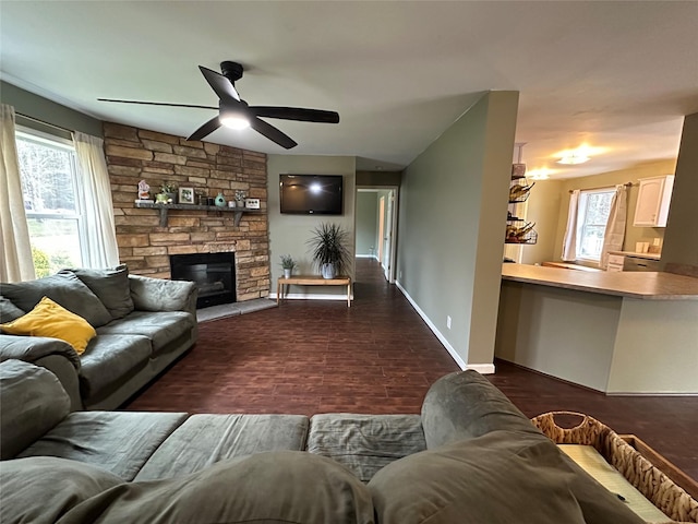 487 Southwoods Dr, Monticello, NY 12701 - living area with ceiling fan, baseboards, and a stone fireplace