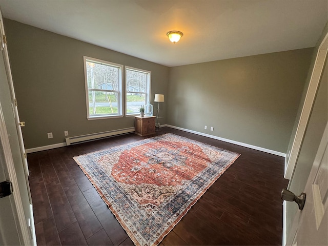 487 Southwoods Dr, Monticello, NY 12701 - bedroom with baseboards, a baseboard radiator, and dark wood finished floors