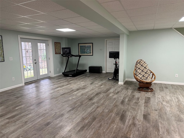 487 Southwoods Dr, Monticello, NY 12701 - workout room with baseboards, a paneled ceiling, and wood finished floors