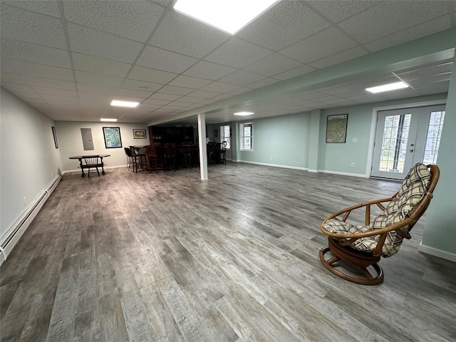 487 Southwoods Dr, Monticello, NY 12701 - below grade area featuring baseboards, a dry bar, wood finished floors, and a drop ceiling