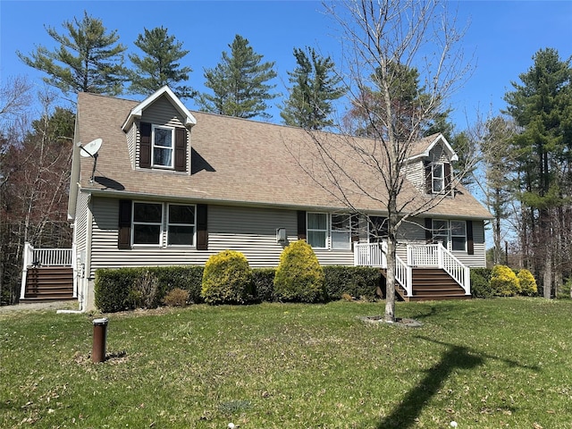 487 Southwoods Dr, Monticello, NY 12701 - cape cod home featuring stairway, a front lawn, and roof with shingles