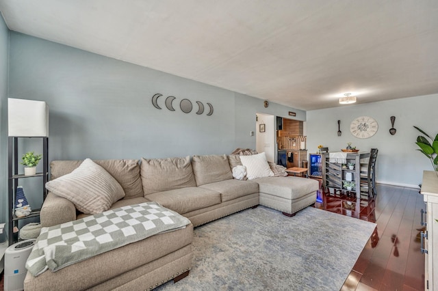 living area with hardwood / wood-style floors and baseboards