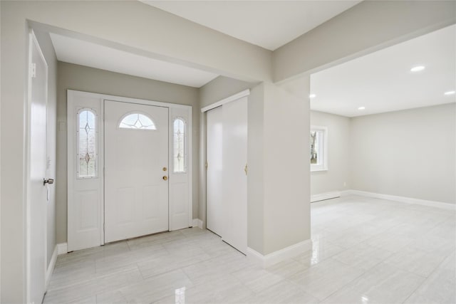 entrance foyer featuring recessed lighting and baseboards