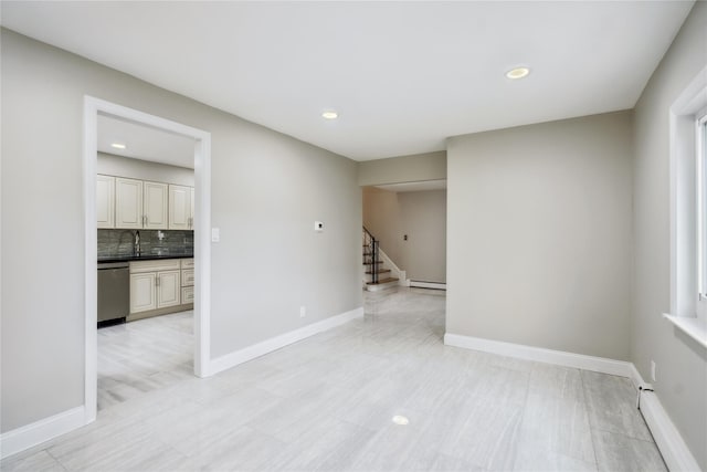 empty room featuring stairs, recessed lighting, baseboards, and baseboard heating
