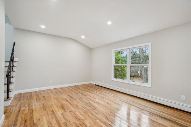unfurnished room with baseboards, baseboard heating, recessed lighting, and light wood-style flooring