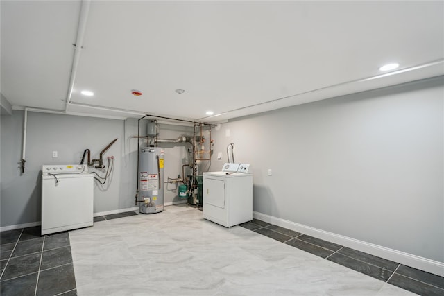laundry area featuring gas water heater, laundry area, independent washer and dryer, tile patterned flooring, and recessed lighting