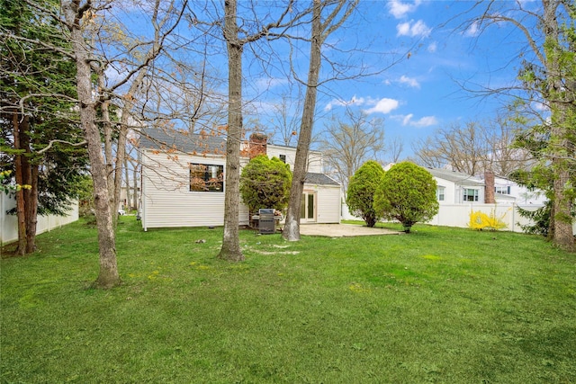 view of yard featuring a patio area and fence