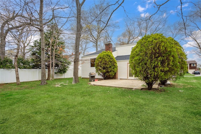 view of yard featuring a patio area and fence