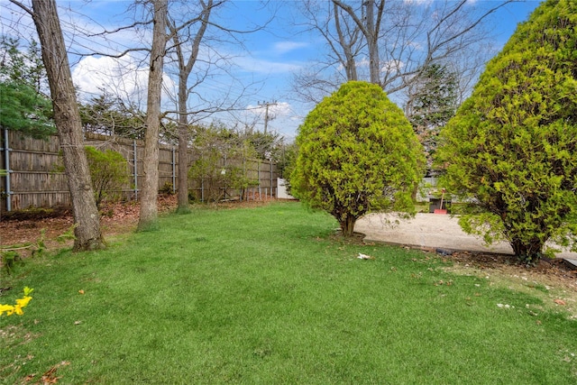 view of yard featuring fence