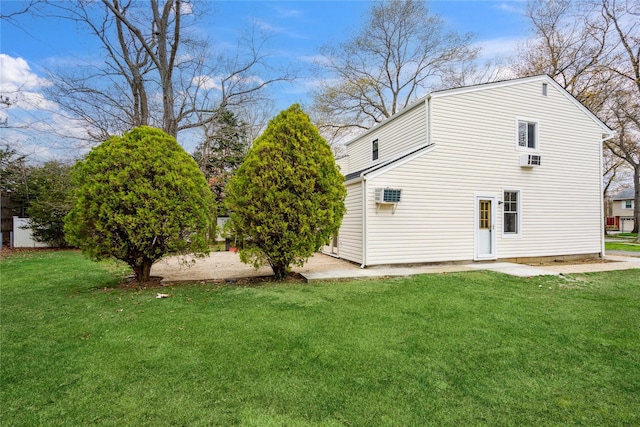 view of side of home featuring a lawn