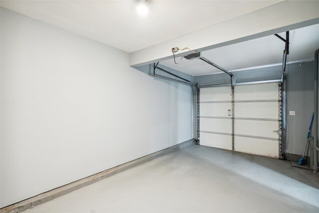 36 Pinewood Dr, Commack, NY 11725 - garage featuring a garage door opener