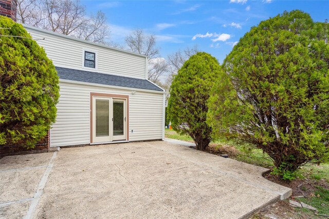 36 Pinewood Dr, Commack, NY 11725 - back of property with a patio and a shingled roof