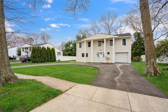 36 Pinewood Dr, Commack, NY 11725 - greek revival inspired property featuring driveway and a garage