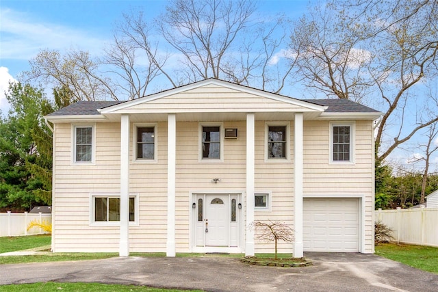 36 Pinewood Dr, Commack, NY 11725 - view of front of home with driveway, an attached garage, and a shingled roof