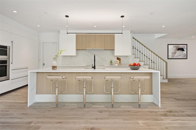 41 Richmondville Ave Unit Duplex 2, Call Listing Agent, CT 06880 - kitchen featuring modern cabinets, light wood finished floors, a sink, white cabinetry, and recessed lighting