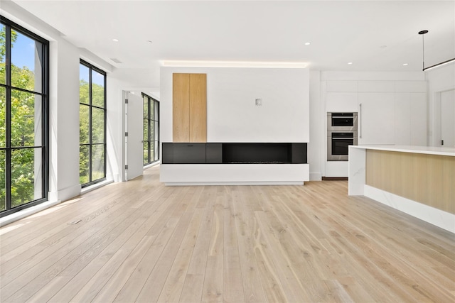 41 Richmondville Ave Unit Duplex 2, Call Listing Agent, CT 06880 - unfurnished living room with light wood finished floors