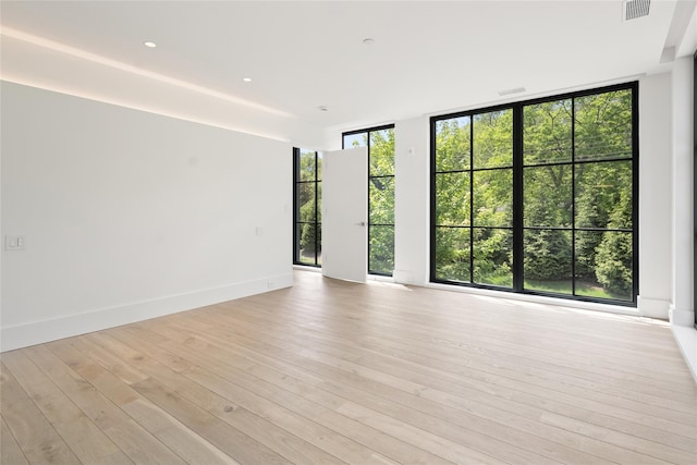 41 Richmondville Ave Unit Duplex 2, Call Listing Agent, CT 06880 - unfurnished room featuring light wood-style floors and a wall of windows