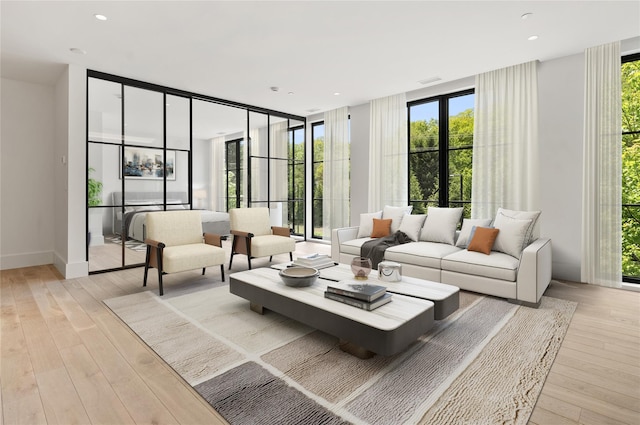 41 Richmondville Ave Unit Duplex 2, Call Listing Agent, CT 06880 - living area featuring floor to ceiling windows, plenty of natural light, and light wood-style flooring