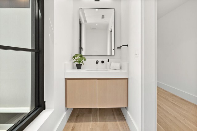 41 Richmondville Ave Unit Duplex 2, Call Listing Agent, CT 06880 - bathroom featuring vanity, wood finished floors, and baseboards