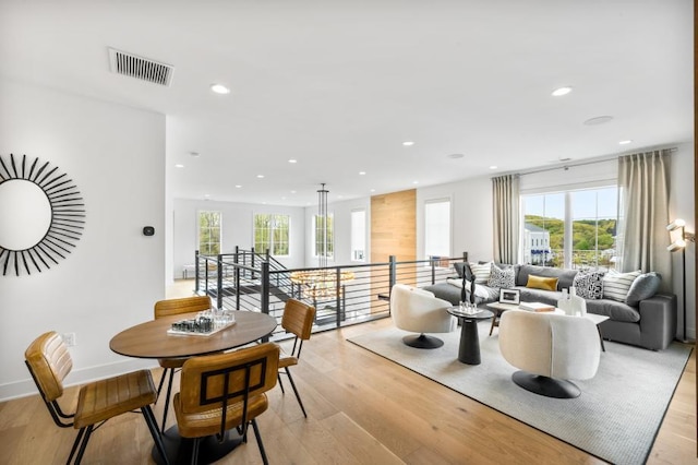 interior space featuring visible vents, a healthy amount of sunlight, light wood-style flooring, and recessed lighting