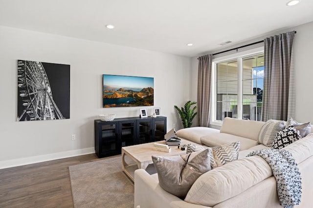 living area featuring wood finished floors, recessed lighting, and visible vents