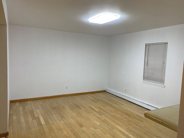 841 Prescott Pl, West Babylon, NY 11704 - empty room with baseboard heating, light wood-style floors, and baseboards