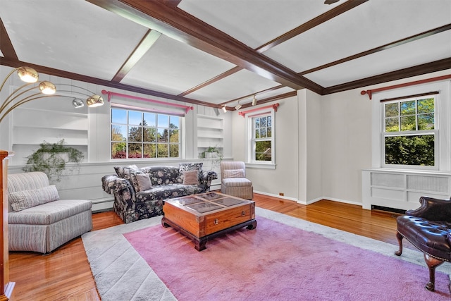 living room with crown molding, beam ceiling, built in features, wood finished floors, and a baseboard radiator