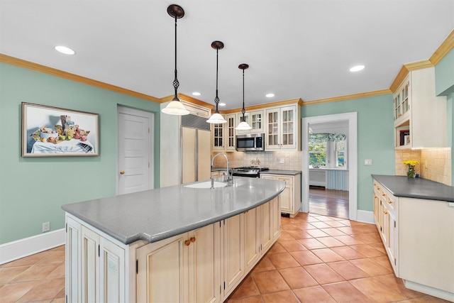 kitchen featuring a sink, dark countertops, stainless steel microwave, and backsplash