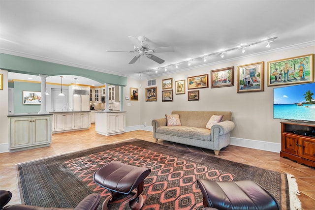 living area featuring light tile patterned floors, baseboards, ceiling fan, and rail lighting