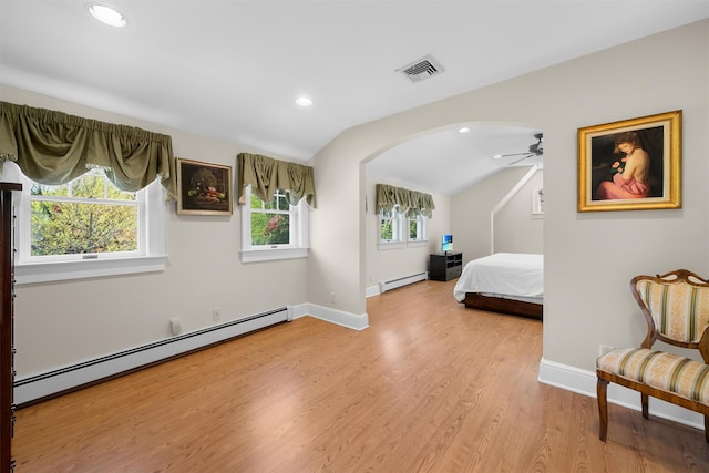 bedroom with visible vents, a baseboard radiator, arched walkways, and lofted ceiling