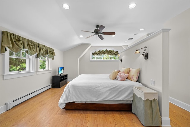 bedroom with light wood-type flooring, recessed lighting, baseboard heating, and visible vents