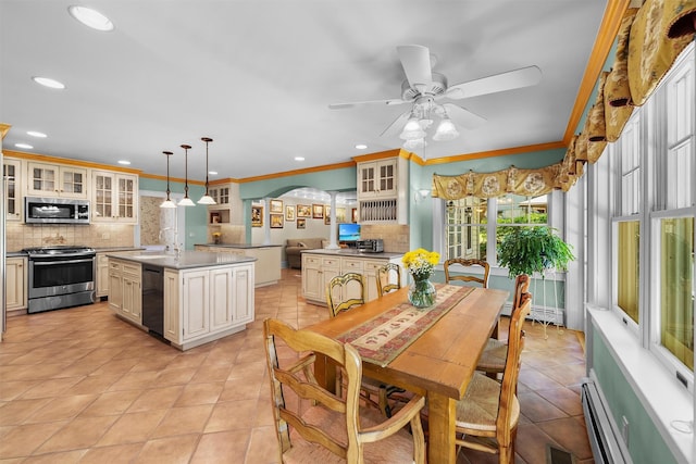 kitchen featuring visible vents, crown molding, tasteful backsplash, and stainless steel appliances