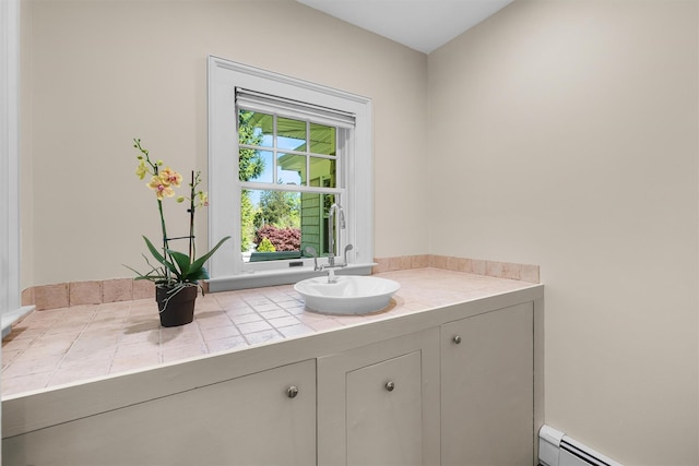 bathroom featuring vanity and a baseboard radiator