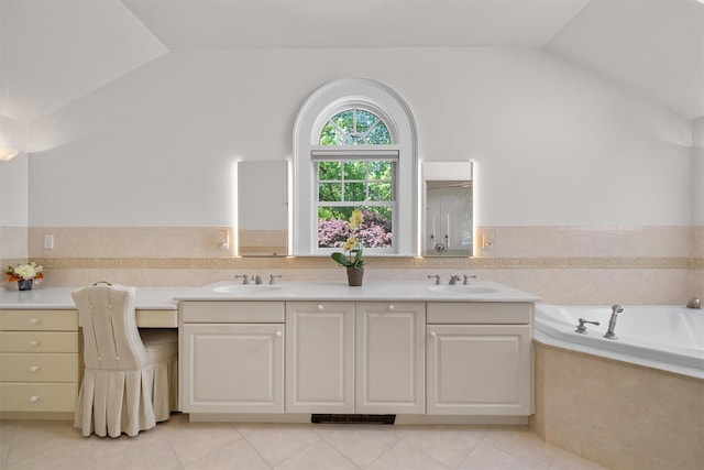 full bath featuring a sink, tile patterned floors, and lofted ceiling