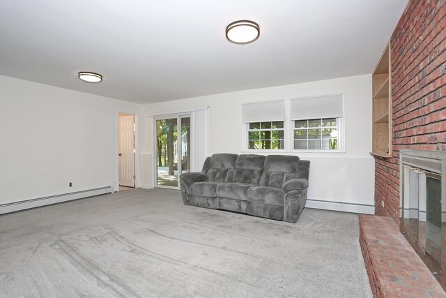 carpeted living area featuring a baseboard heating unit, a fireplace, and baseboard heating