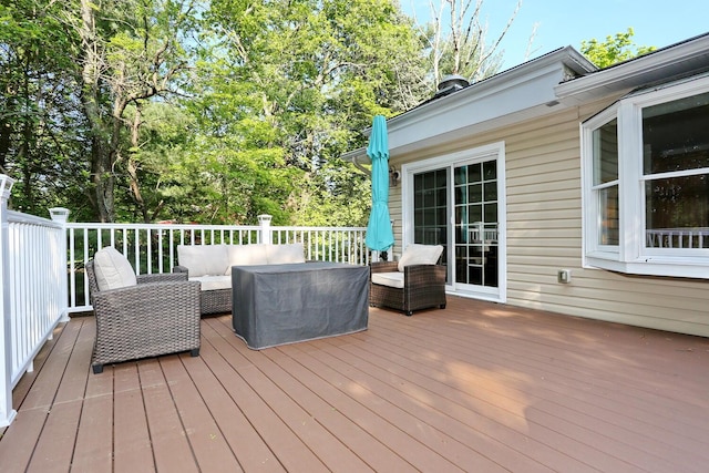 wooden terrace with an outdoor hangout area