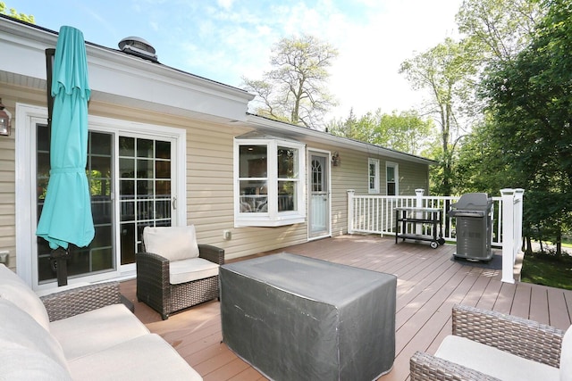 wooden deck with area for grilling