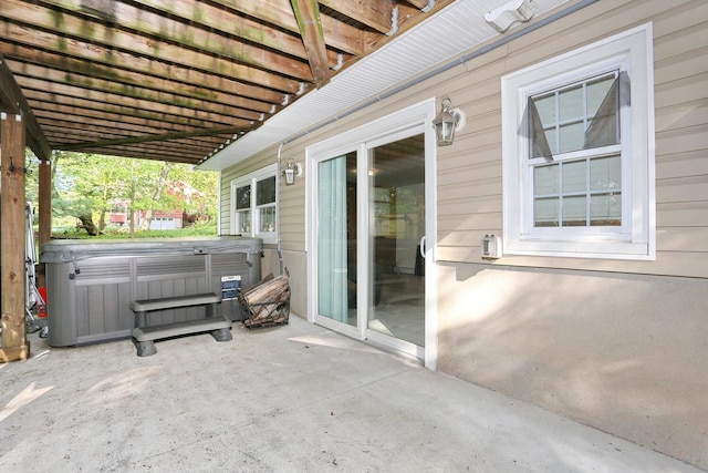 view of patio / terrace featuring a hot tub