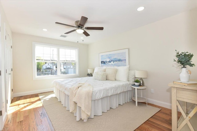 bedroom featuring visible vents, baseboards, recessed lighting, and light wood-style floors