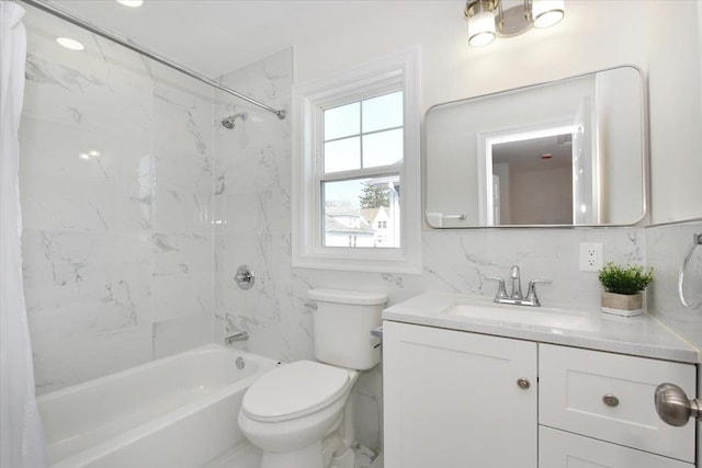 bathroom featuring vanity, toilet, bathtub / shower combination, and backsplash