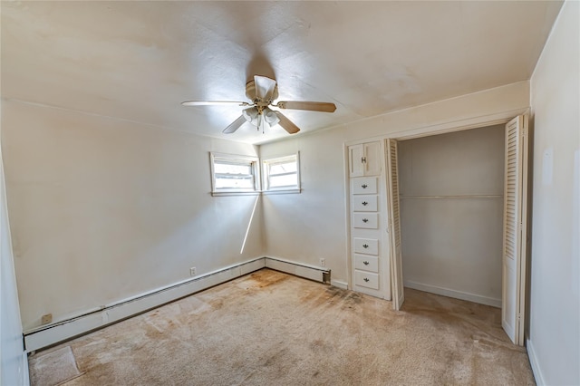 unfurnished bedroom featuring a ceiling fan, light carpet, baseboards, a baseboard radiator, and baseboard heating