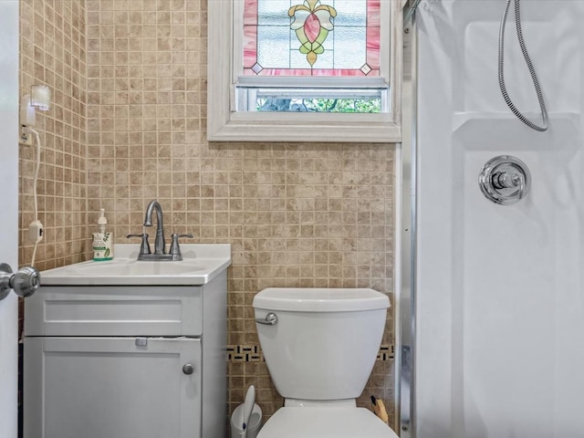 123-19 7th Ave, College Point, NY 11356 - bathroom with a shower, tile walls, vanity, and toilet