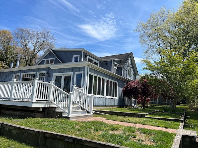back of property featuring a deck