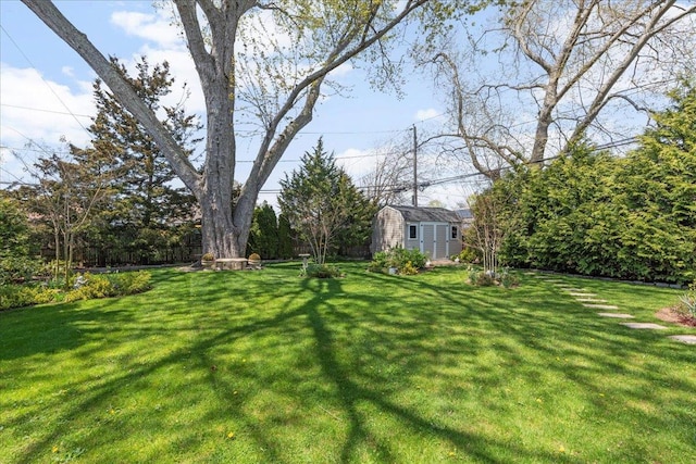 view of yard featuring an outbuilding and a storage shed