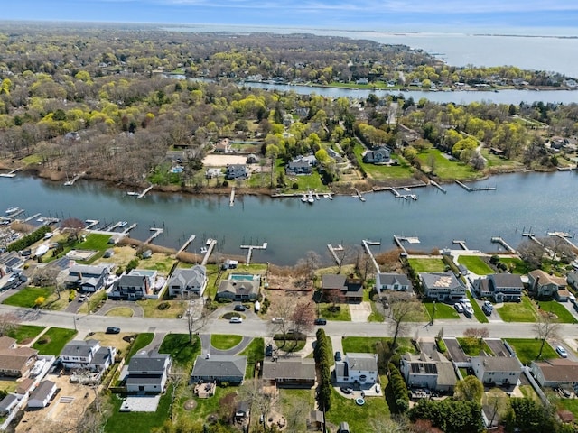 drone / aerial view with a residential view and a water view