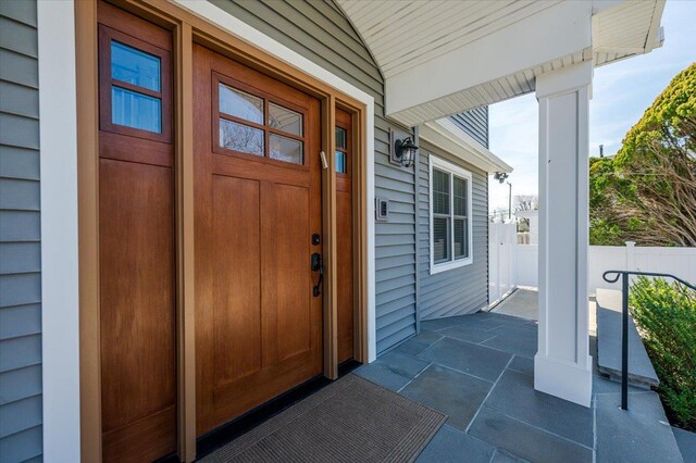 doorway to property with a porch